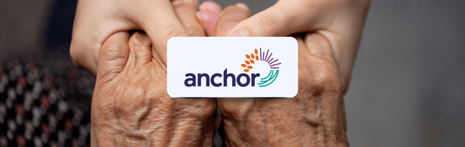 alt="Anchor logo over hands of a younger person gently holding an older person's hands, representing Matrix’s partnership in supporting the care sector."