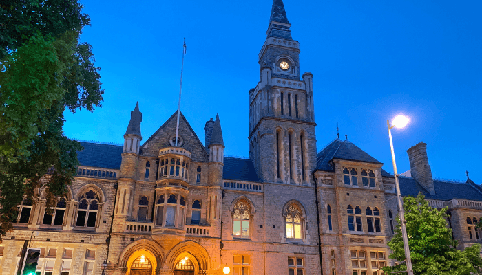 Ealing Town Hall illuminated at dusk, home to Ealing Council's HAF programme built on seamless scalability with Matrix.