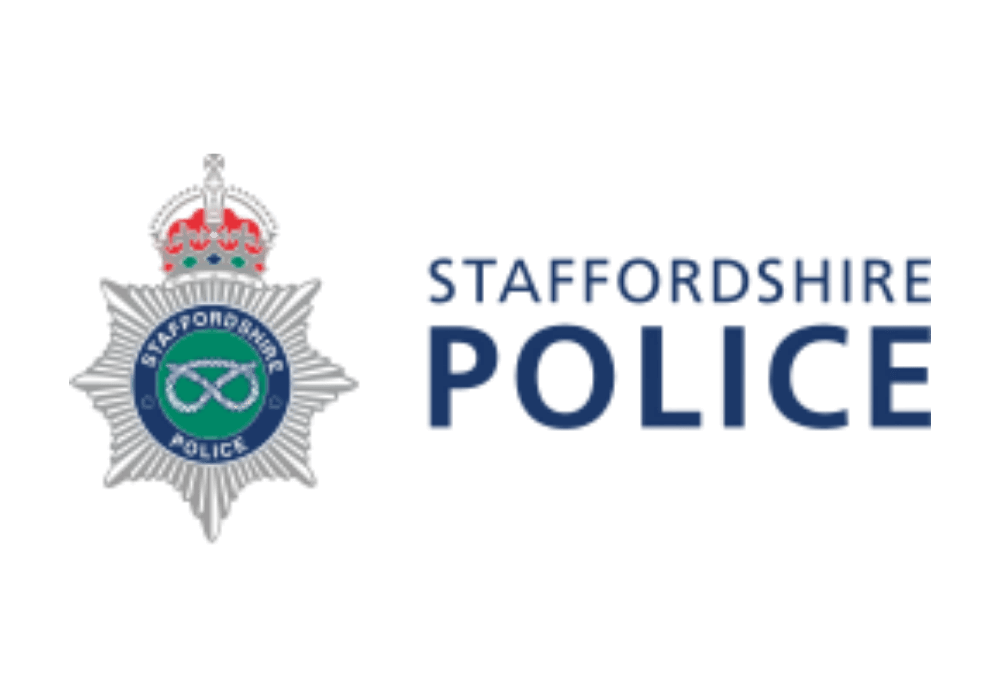 Staffordshire Police badge and logo featuring a star with a crown on top and a green circular emblem in the centre.